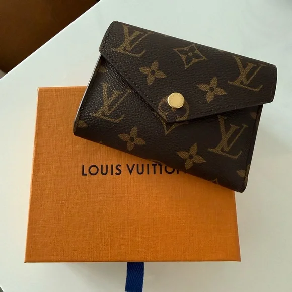 Louis Vuitton Black and Gold Monogram Wallet - Picture 1 of 3